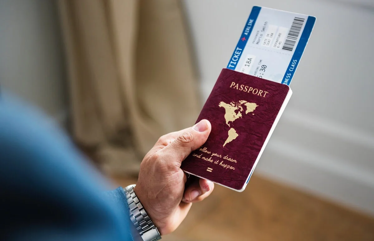 Passport and boarding pass held by a traveller