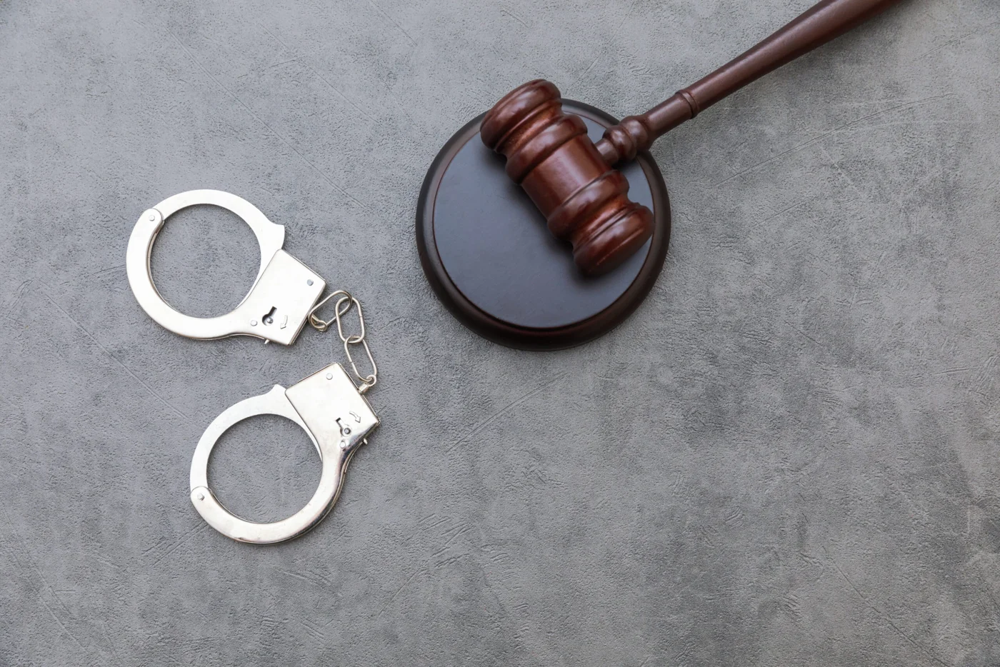 Gavel and handcuffs illustrating criminal legal matters