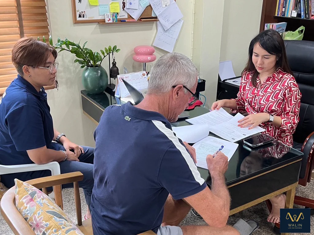 Reviewing paperwork together during an office appointment.